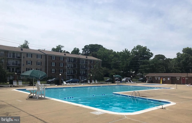 view of pool featuring a patio area