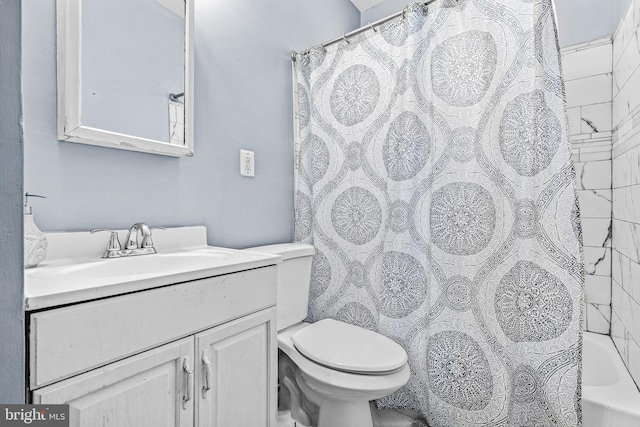 full bathroom with toilet, vanity, and shower / tub combo with curtain