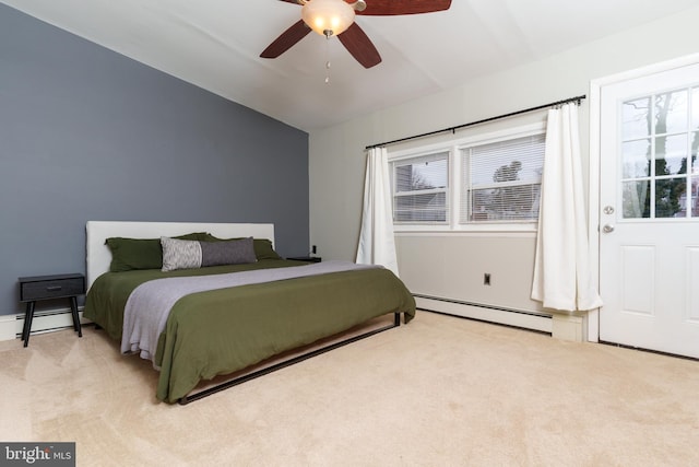 bedroom featuring light carpet, baseboard heating, and ceiling fan