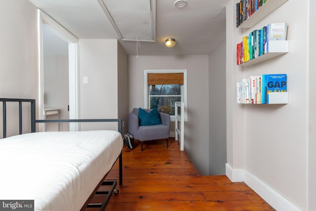 bedroom with hardwood / wood-style flooring