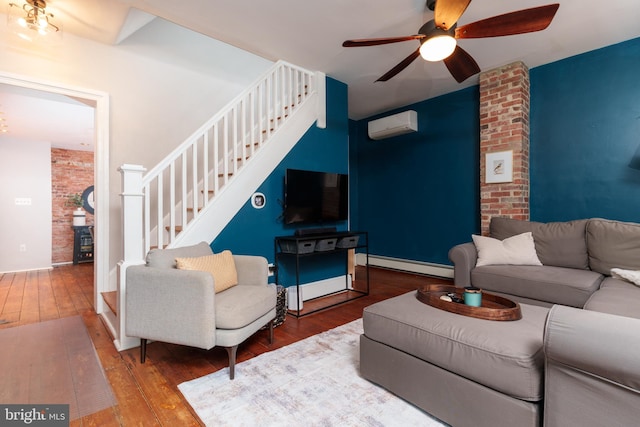 living room with ceiling fan, hardwood / wood-style floors, a wall mounted AC, and a baseboard radiator