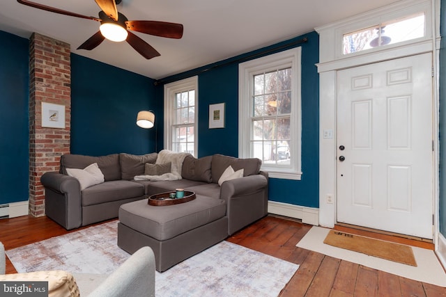 living room with ceiling fan and hardwood / wood-style floors