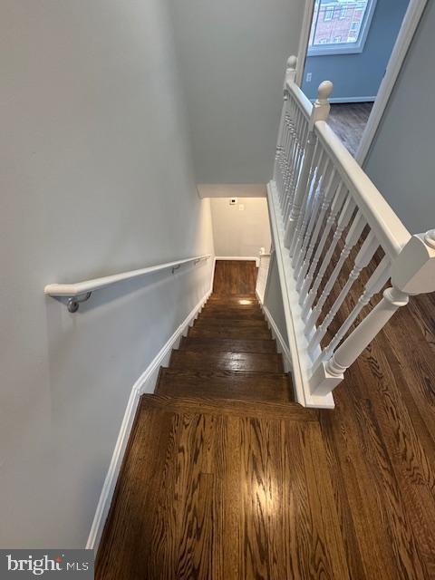 stairway featuring hardwood / wood-style flooring