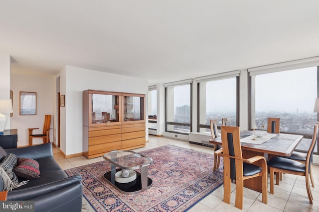 tiled living room featuring floor to ceiling windows