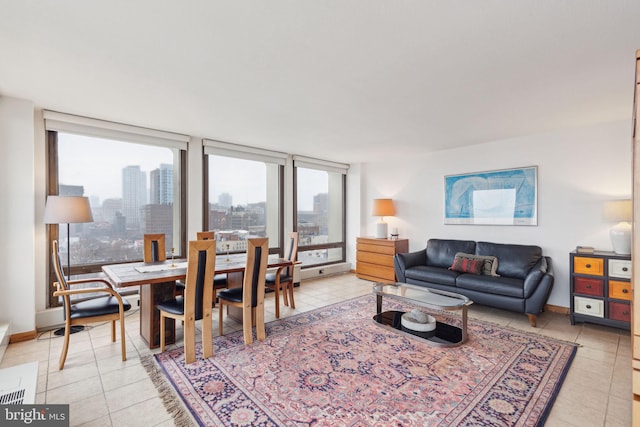 living room with light tile patterned floors and floor to ceiling windows