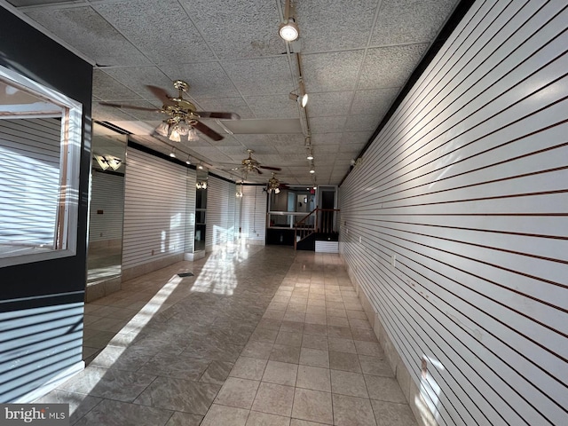 hallway with a drop ceiling