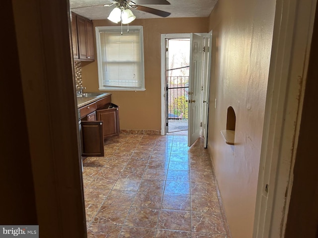 interior space featuring ceiling fan