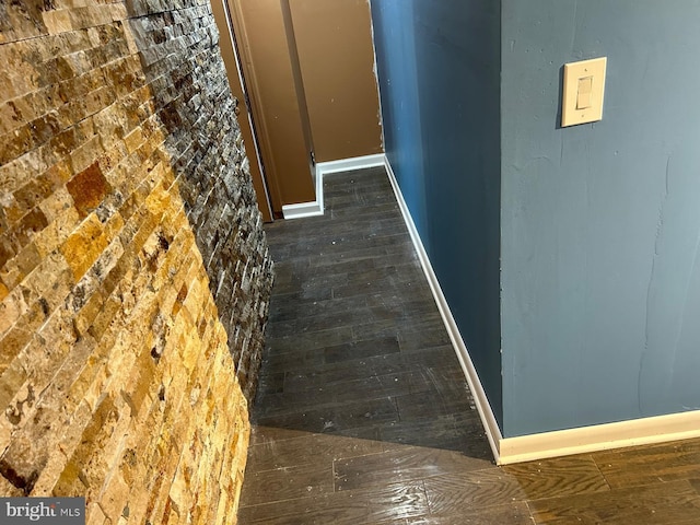 hallway featuring dark hardwood / wood-style floors