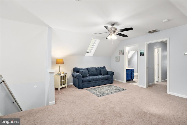 living room featuring ceiling fan, light colored carpet, and vaulted ceiling