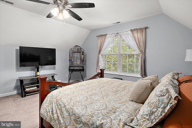 carpeted bedroom featuring vaulted ceiling and ceiling fan