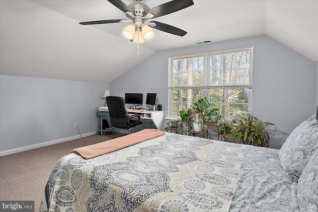 carpeted bedroom with vaulted ceiling and ceiling fan