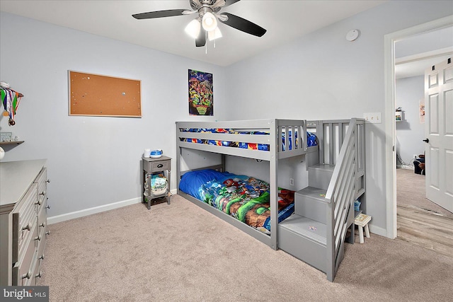 bedroom with ceiling fan and light carpet