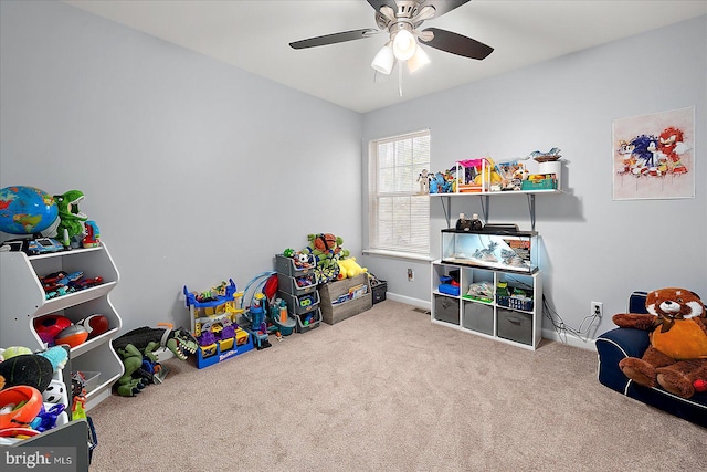 rec room with ceiling fan and carpet flooring