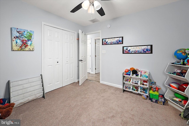 playroom with light carpet and ceiling fan