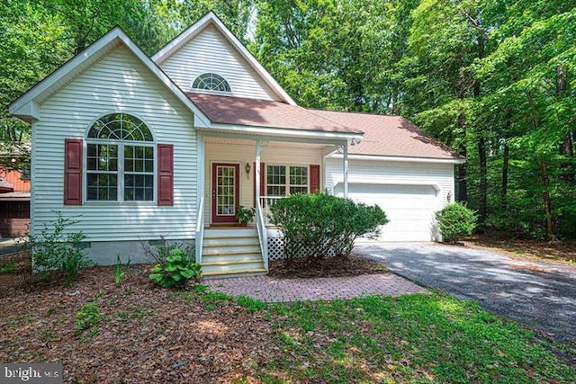 view of front of property featuring a garage and covered porch