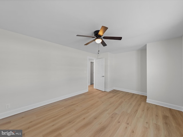 spare room featuring light hardwood / wood-style flooring and ceiling fan