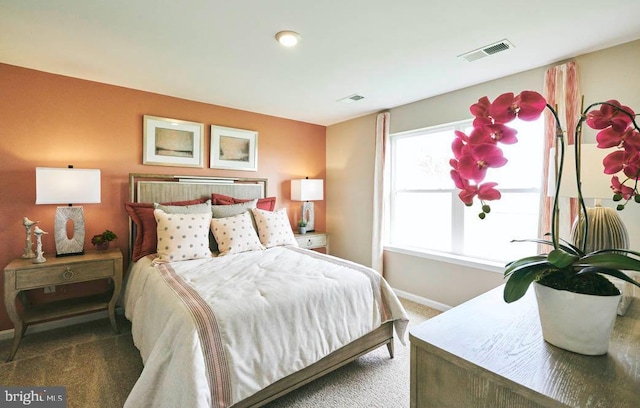 bedroom with dark carpet