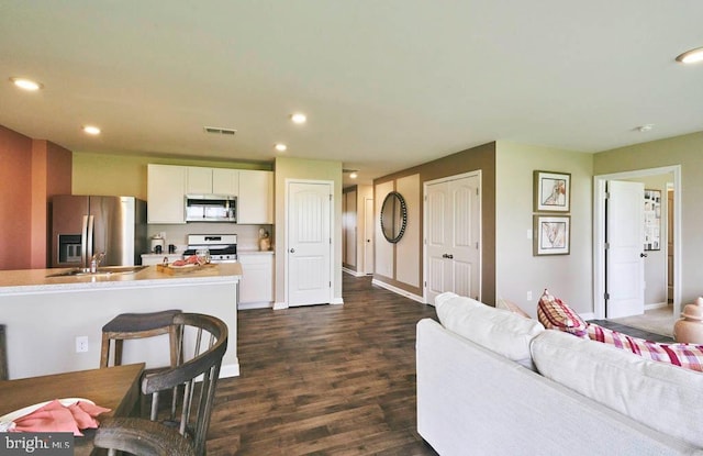 living room featuring dark wood-type flooring