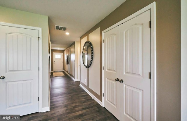 hallway featuring dark hardwood / wood-style flooring