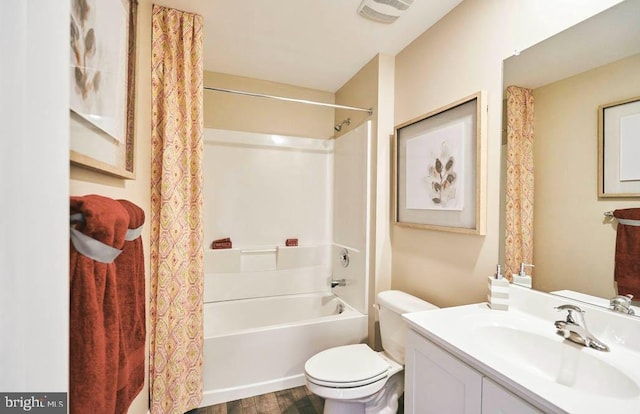 full bathroom featuring toilet, vanity, shower / bath combination with curtain, and hardwood / wood-style floors
