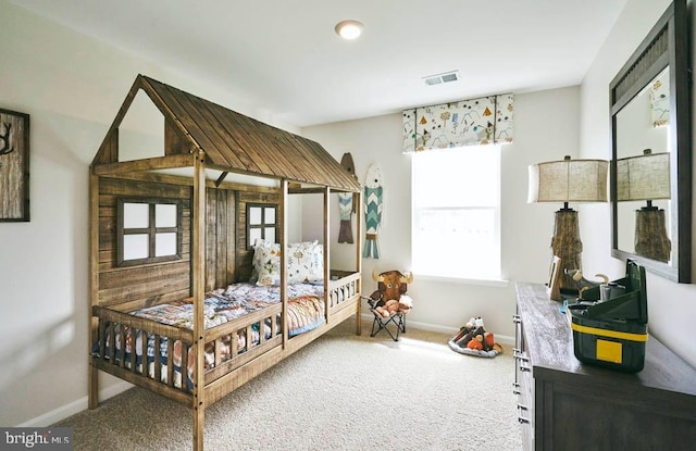carpeted bedroom with multiple windows