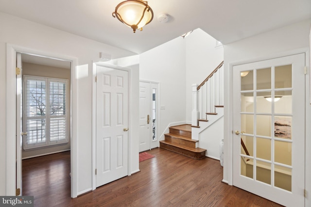 entryway with dark wood-type flooring