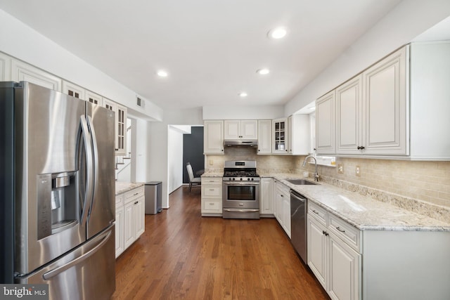 kitchen featuring sink, white cabinets, and appliances with stainless steel finishes