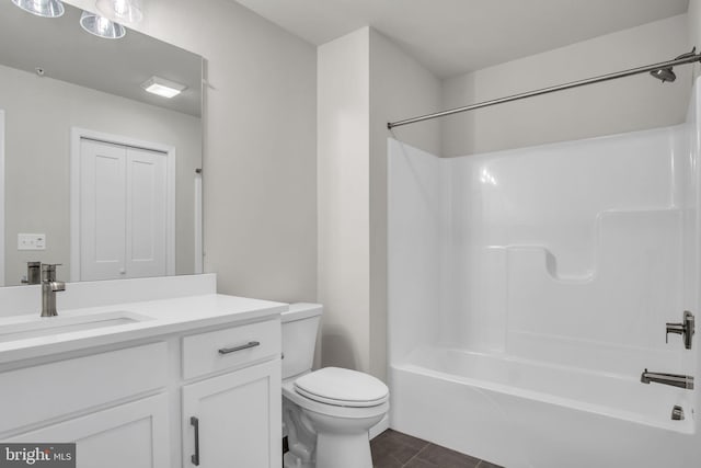 full bathroom featuring shower / bathing tub combination, vanity, toilet, and tile patterned floors