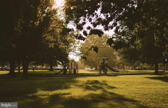 view of community with a yard and a playground