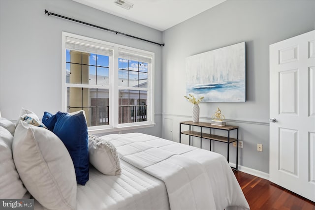 bedroom featuring dark wood-type flooring