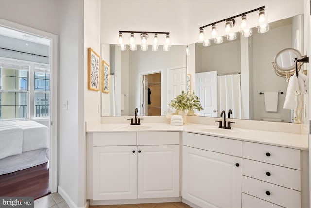 bathroom featuring tile patterned flooring and vanity