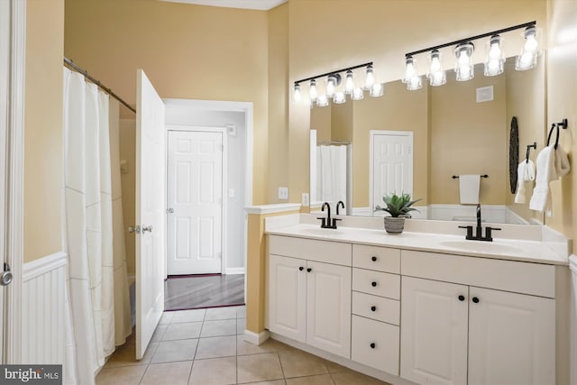 bathroom with vanity and tile patterned floors