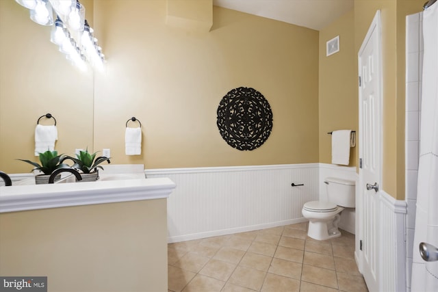 bathroom with tile patterned floors and toilet