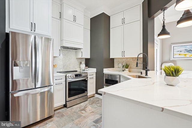 kitchen featuring sink, appliances with stainless steel finishes, light stone counters, tasteful backsplash, and white cabinets