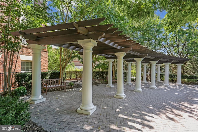 view of home's community featuring a pergola and a patio