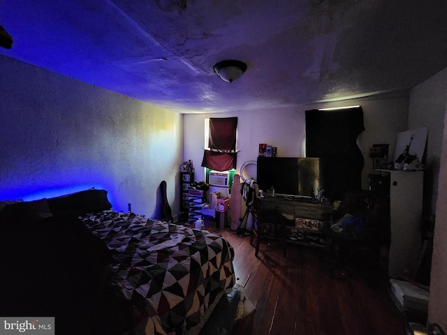 bedroom with wood-type flooring