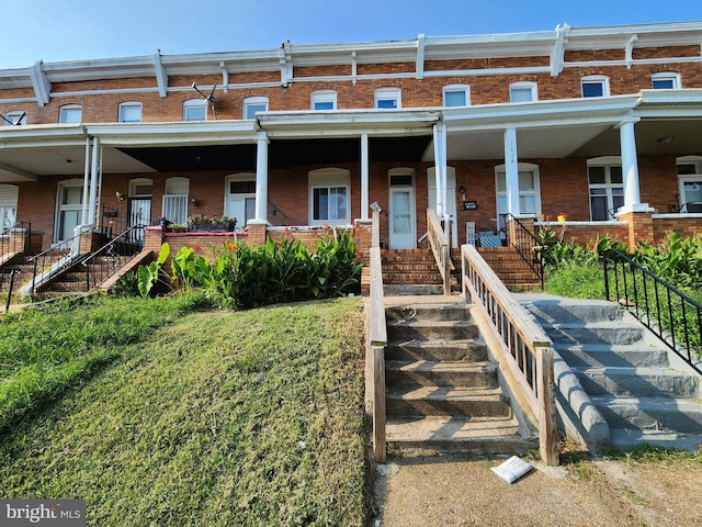 view of property with a porch