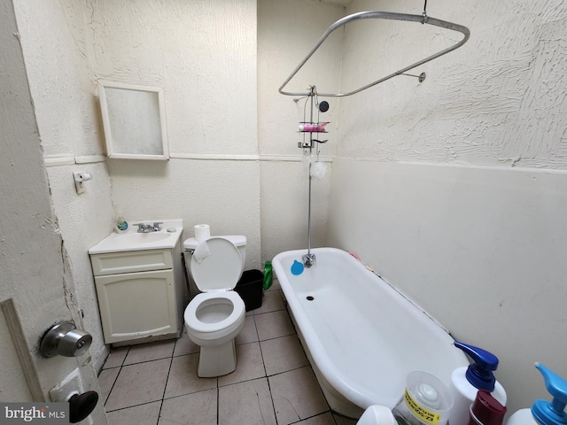 full bathroom featuring sink, tile patterned flooring, toilet, and shower / bathtub combination