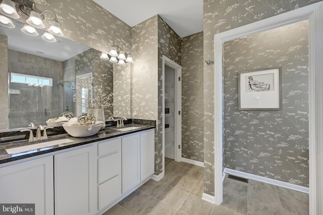 bathroom with vanity, tile patterned flooring, and a shower with shower door