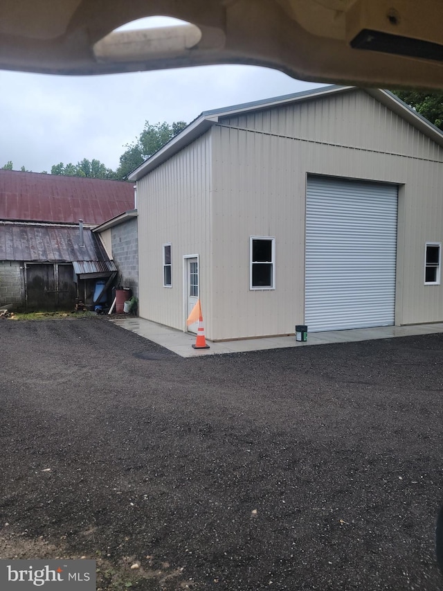 view of property exterior with a garage