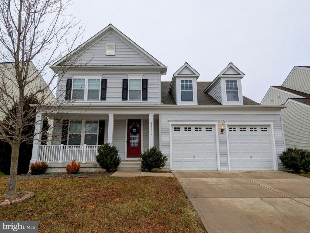 view of front of property featuring a garage and covered porch