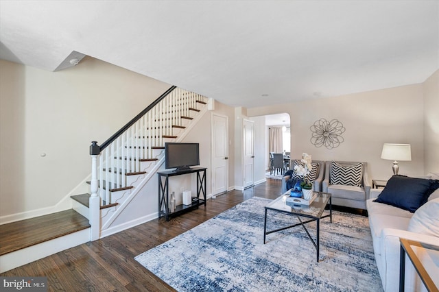 living room with dark hardwood / wood-style floors