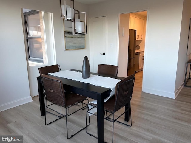 dining space featuring light hardwood / wood-style floors