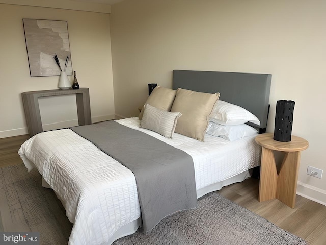 bedroom featuring wood-type flooring