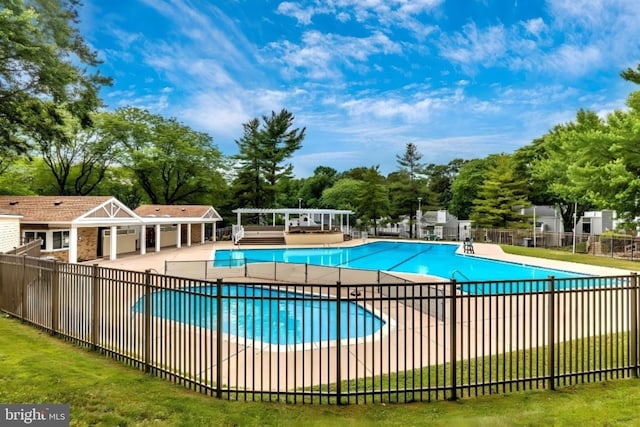 view of pool featuring a pergola and a patio