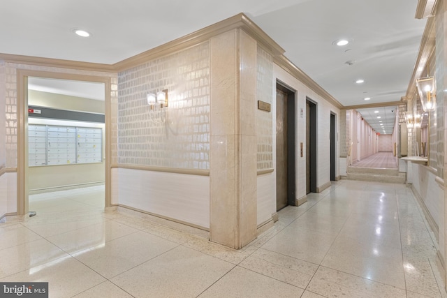 hall with mail boxes and crown molding