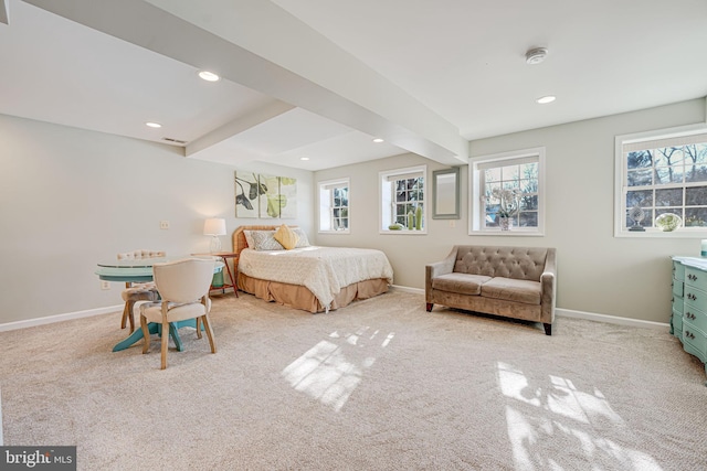 bedroom featuring light colored carpet and multiple windows