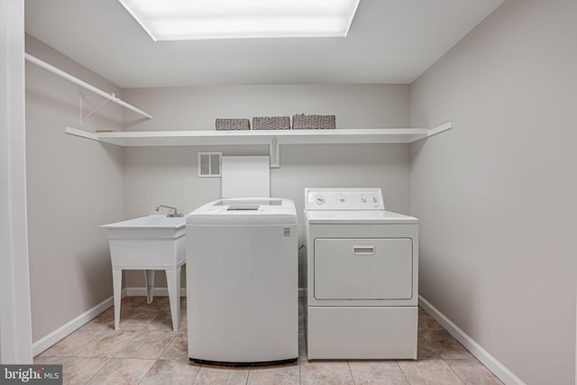 washroom with washer and dryer