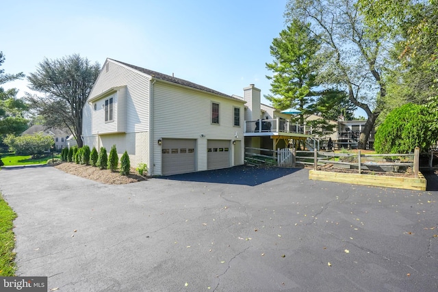 view of side of property featuring a garage