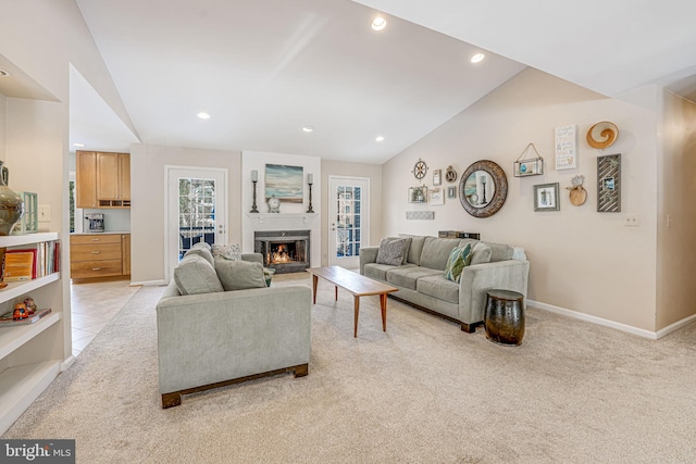 living room with lofted ceiling and light carpet